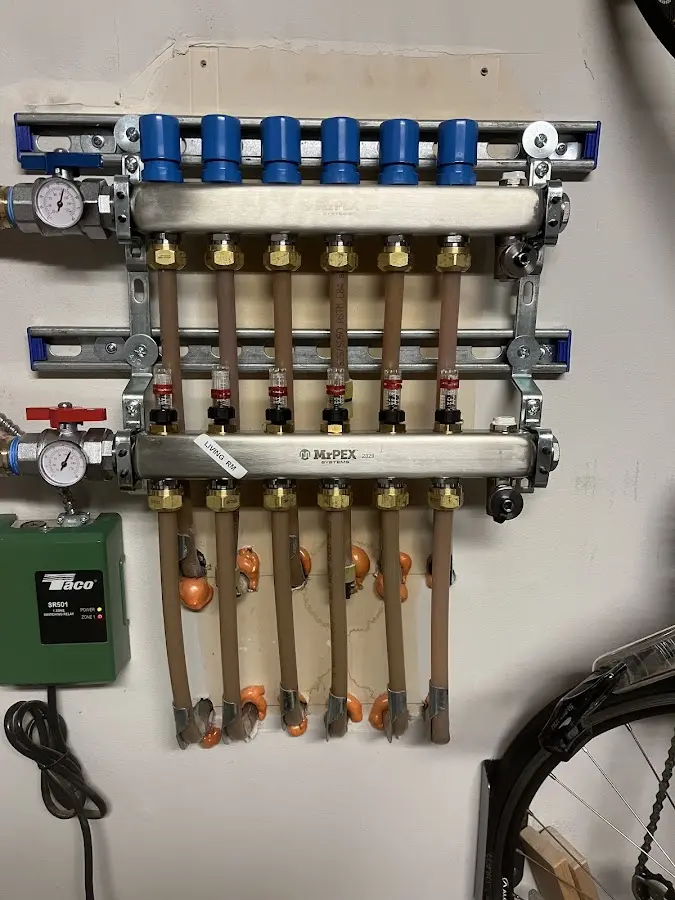 Plumber performing Water Heater Repair at a residential property in Elk